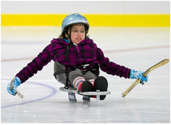 Picture of girl playing sledge hockey